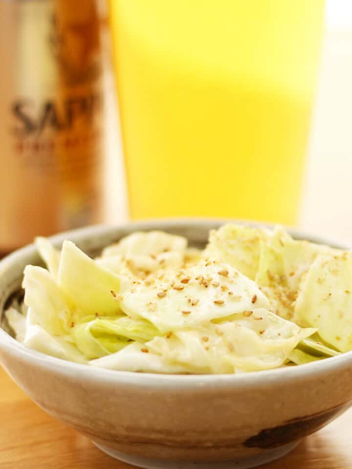 Japanese cabbage salad with Japanese beer in background