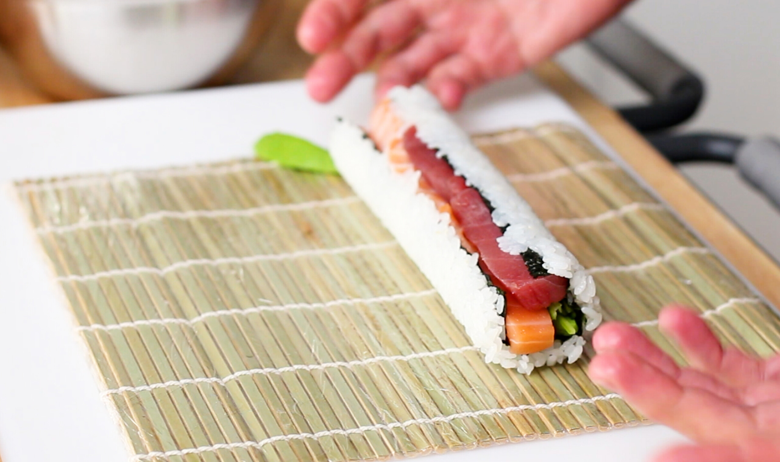 Overstuffed sushi roll falling apart