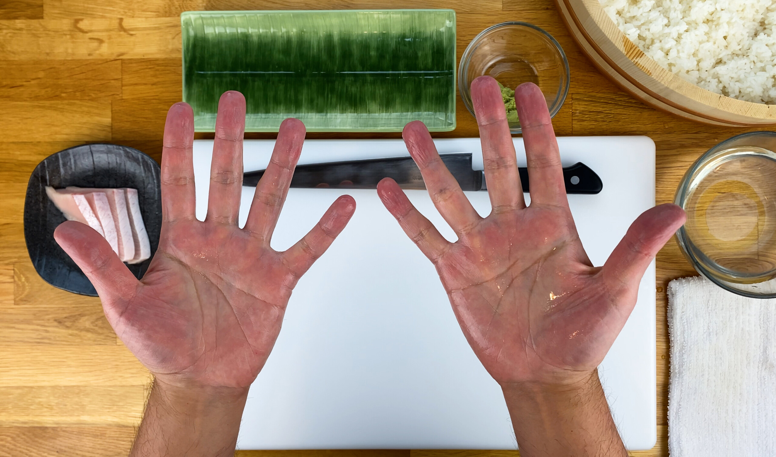 Palm of hands wet and shiny for making sushi