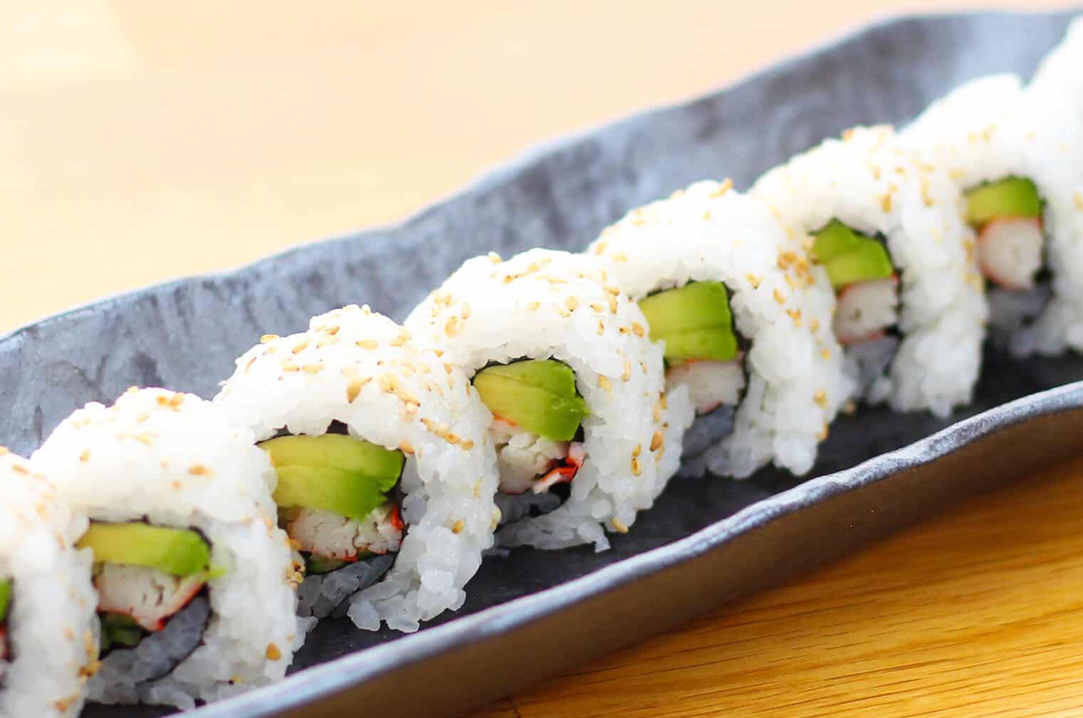Closeup image of a California roll sushi