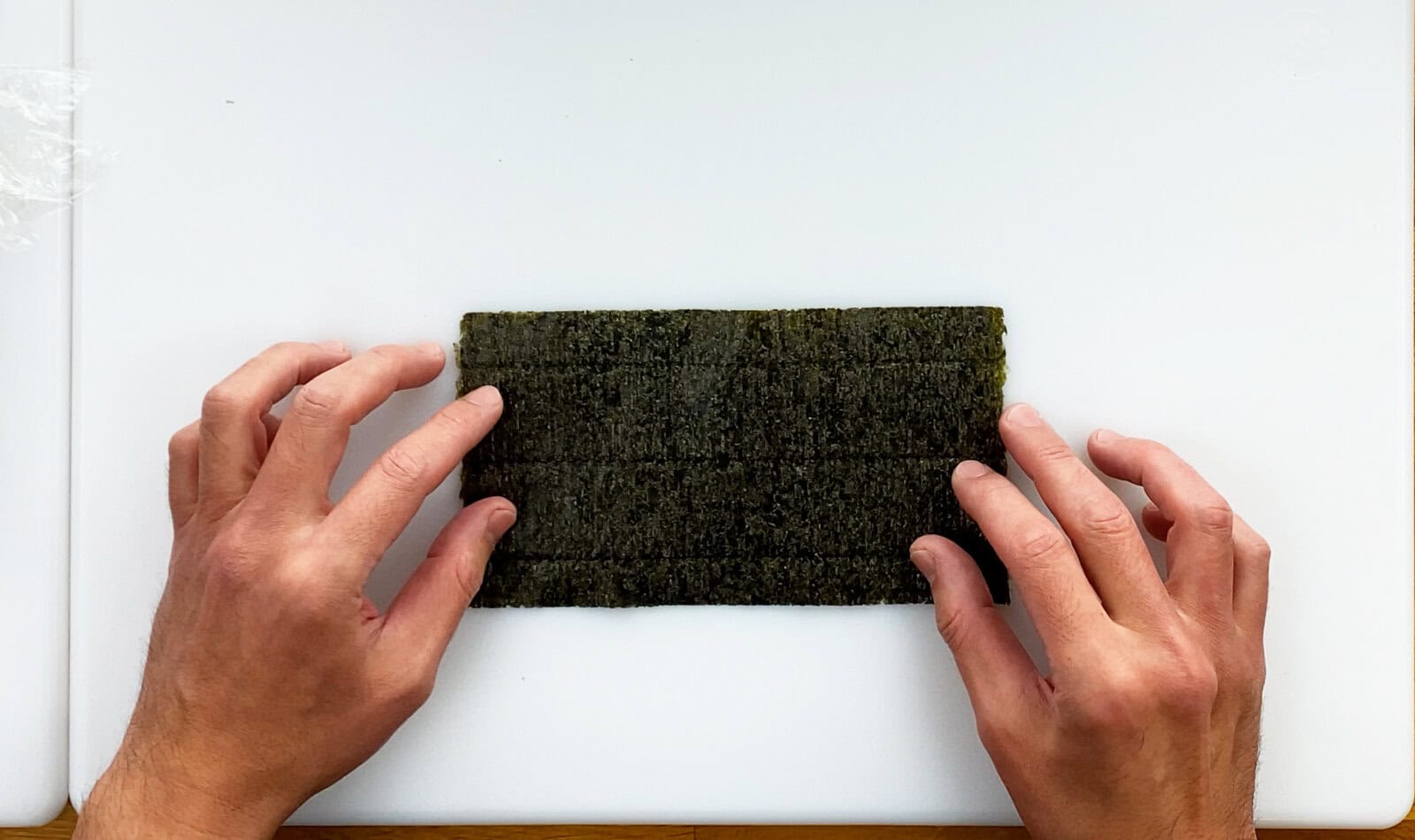 Sheet of nori dried seaweed on cutting board