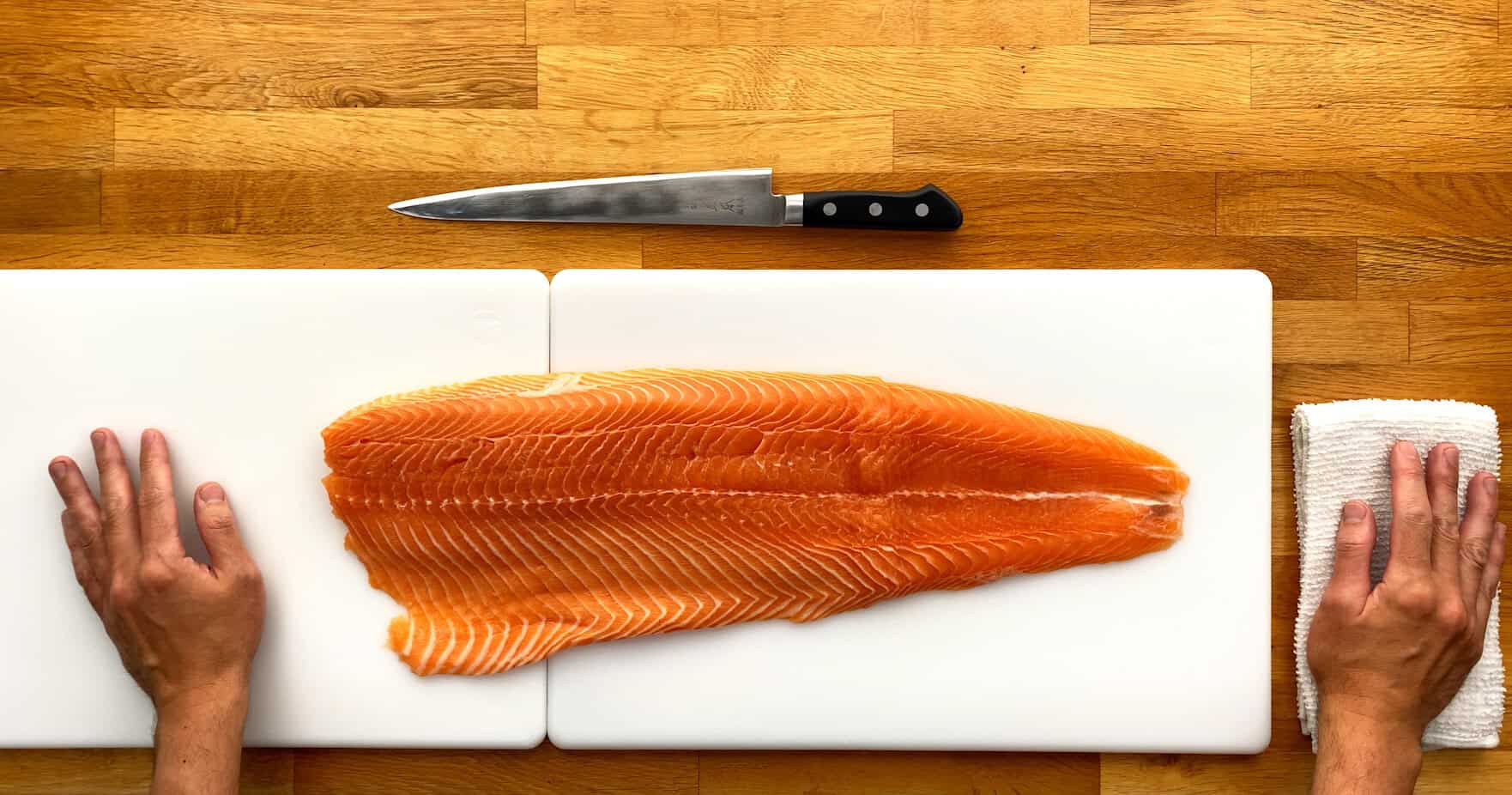 Costco salmon about to be prepared on cutting board