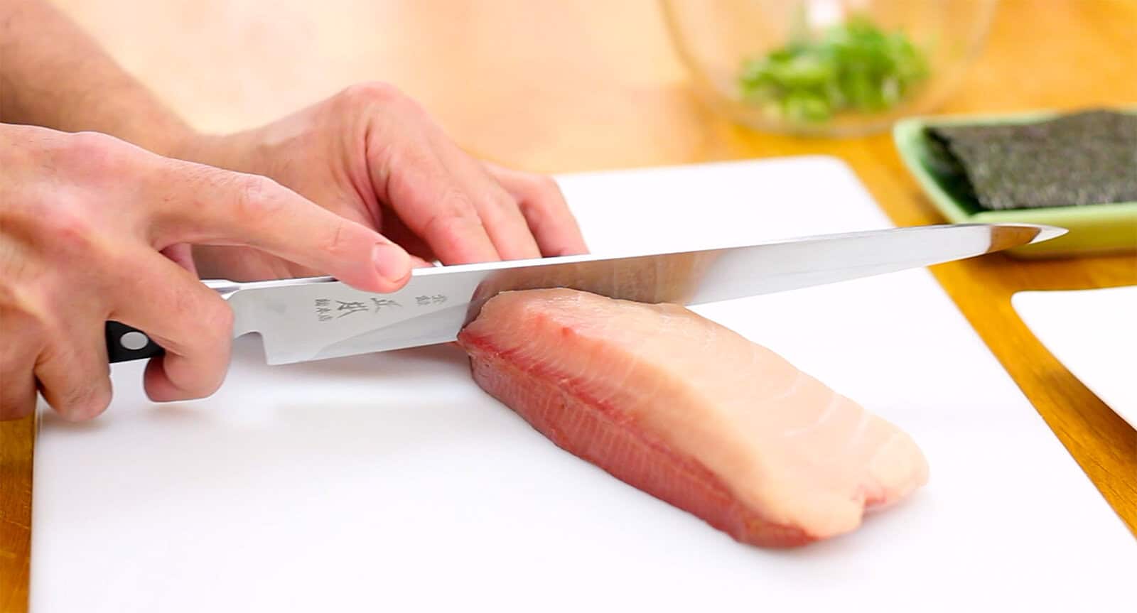 Slicing fish for sushi with a Masamoto sujihiki knife