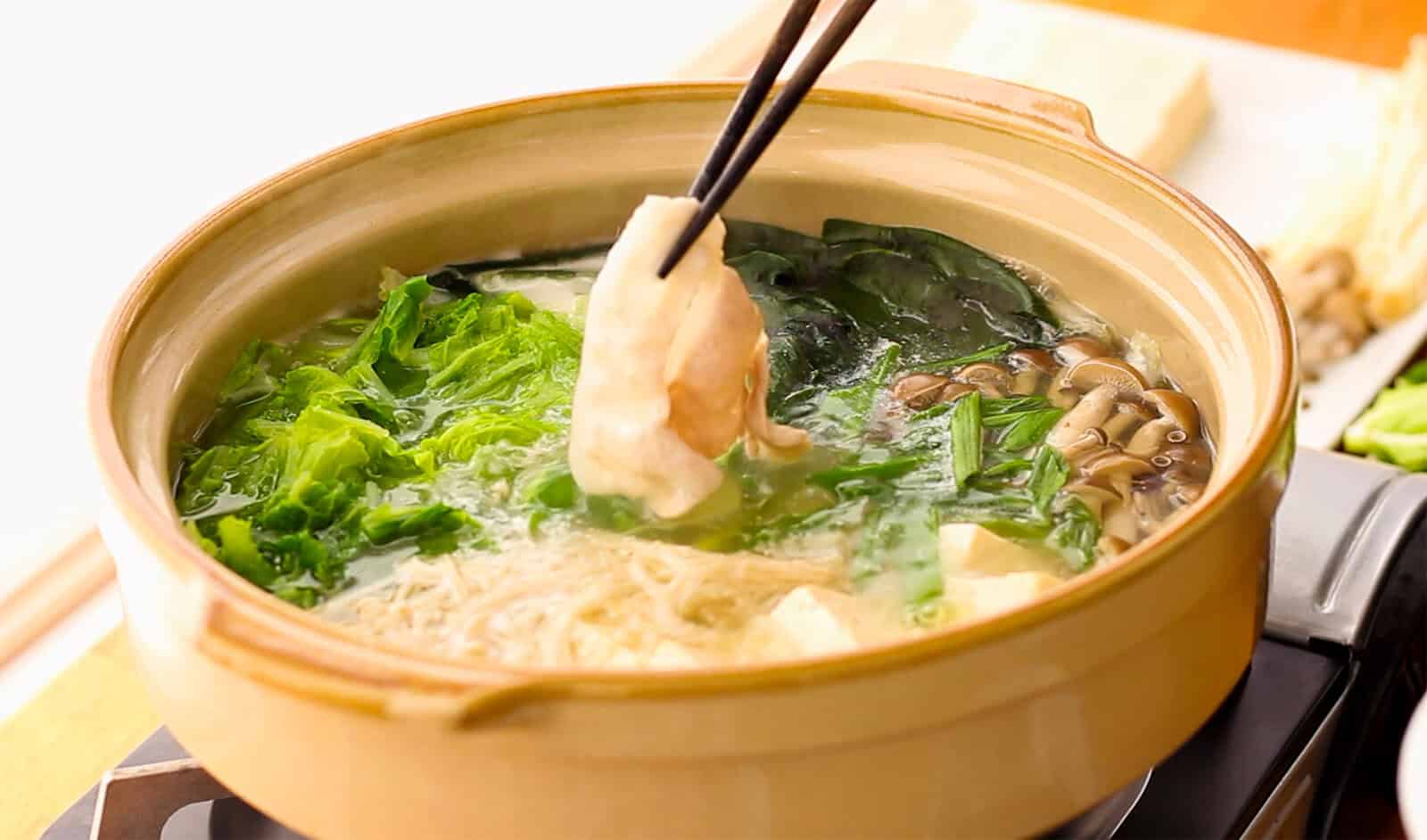 Thinly sliced pork lifted from a simmering pot of shabu shabu with napa cabbage, mushrooms, and tofu.